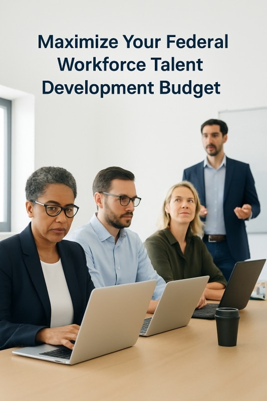 Corporate training workshop with diverse professionals using laptops while a manager leads the session. Represents federal workforce talent development, HR training programs, leadership coaching, and employee skill-building initiatives during hiring freezes.